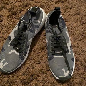 Black camo athletic shoes